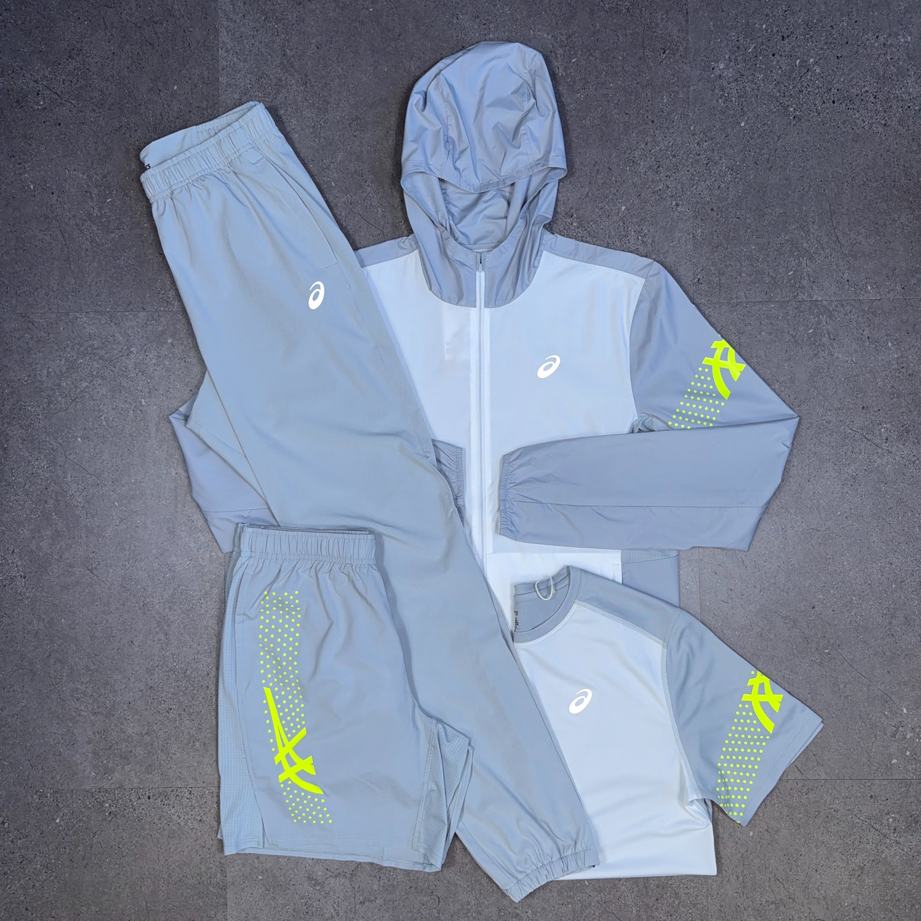 Asics 4 Piece Icon Set Windrunner/T-Shirt/Bottoms/Shorts White/Grey/Neon